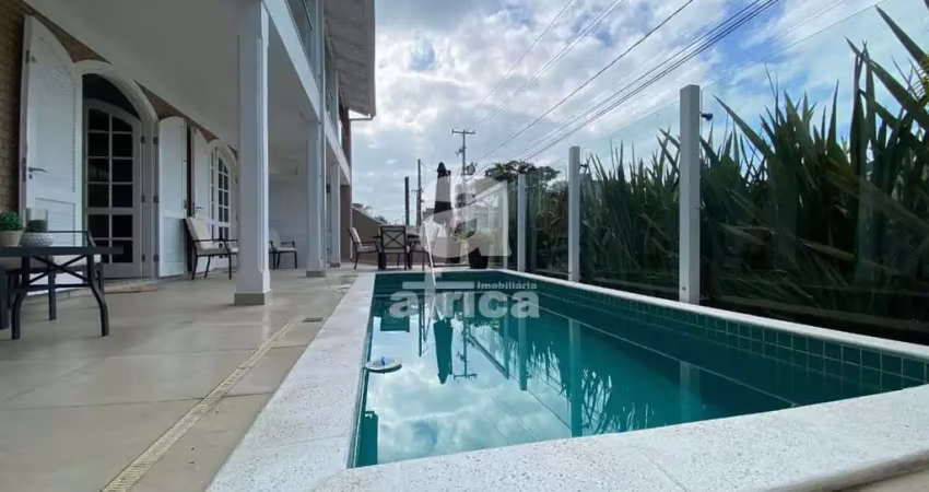 Guaratuba, residência com piscina aquecida, 4 quartos sendo 2 suítes, 4 vagas de garagem, próxima da praia central, guaratuba/pr - imobiliária áfrica, praia central, guaratuba - pr