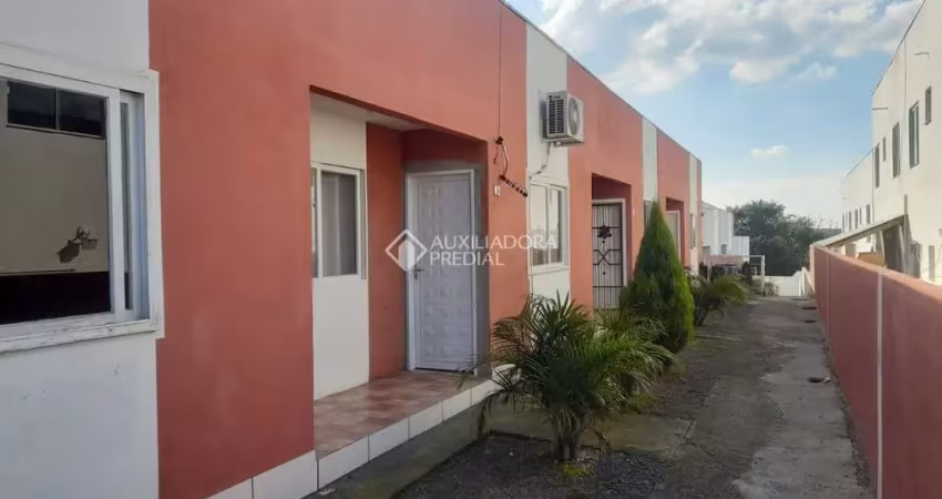 Casa em condomínio fechado com 2 quartos à venda na Rua dos Ipês Roxo, 253, Tarumã, Viamão