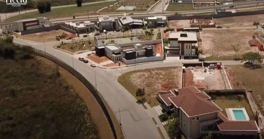 Terreno à venda de esquina - 610 m² no condomínio colinas do paratehy norte - terreno semi plano