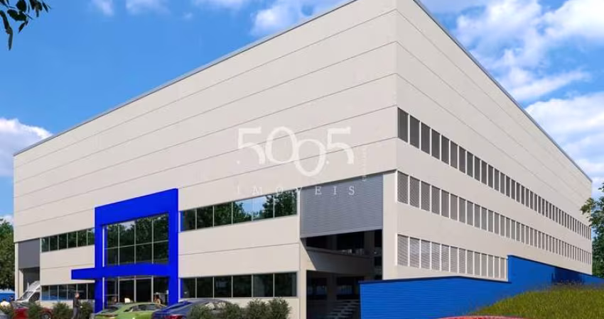 Galpão industrial em construção para locação, entrega em janeiro de 2025, com 1.300m² de área construída e 2.000m² de área total.