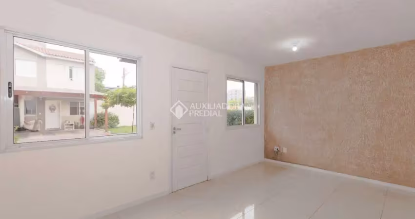 Casa em condomínio fechado com 3 quartos para alugar na Rua dos Guaramirins, 303, Igara, Canoas