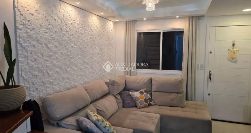 Casa em condomínio fechado com 2 quartos para alugar na Rua Giobatta Giuseppe Petracco, 411, Vila Nova, Porto Alegre