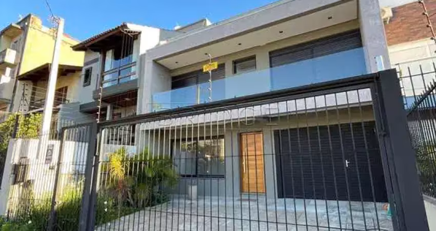 Casa em condomínio fechado com 3 quartos para alugar na Rua Buarque de Macedo, 931, São Geraldo, Porto Alegre