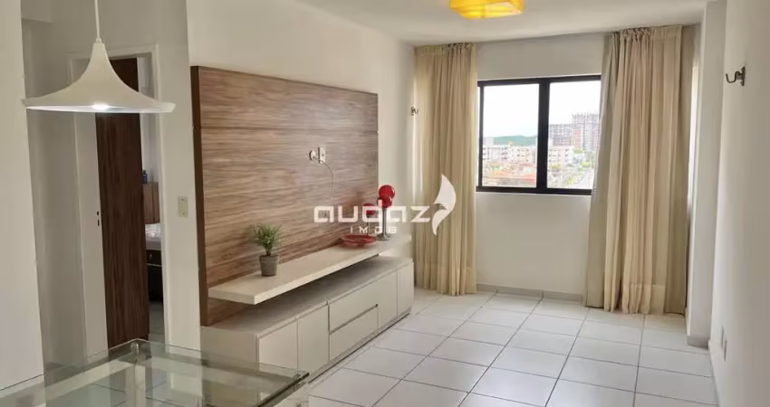 Aluga-se apartamento semi mobiliado com 59m2, 2/4 sendo um suíte.