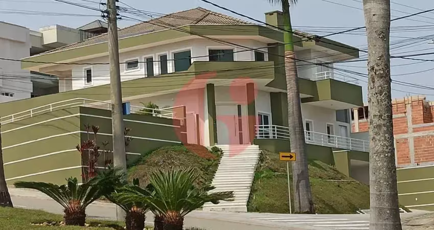 Sobrado em condomínio para venda com 04 quartos (5 suítes) e 08 vagas de garagem - 900m² no jaguary