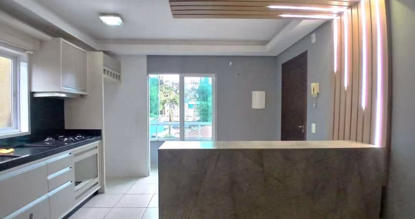 Apartamento com 57m², dois quartos, sacada, churrasqueira e cozinha planejada no bairro Santa Catarina por R$1.700,00 + taxas