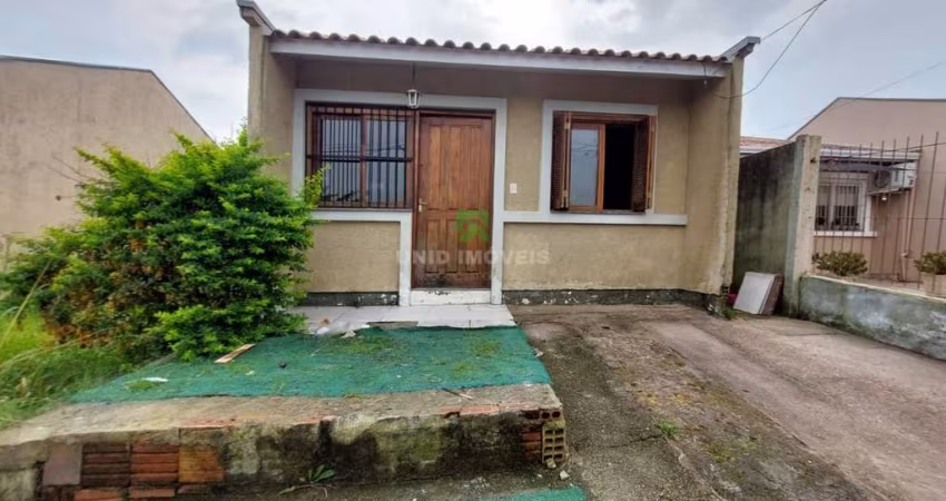 Casa à venda em Porto Alegre-RS, bairro Hípica: 2 quartos, 1 suíte, 2 salas, 2 banheiros, garagem e 80m² de área. Imperdível!