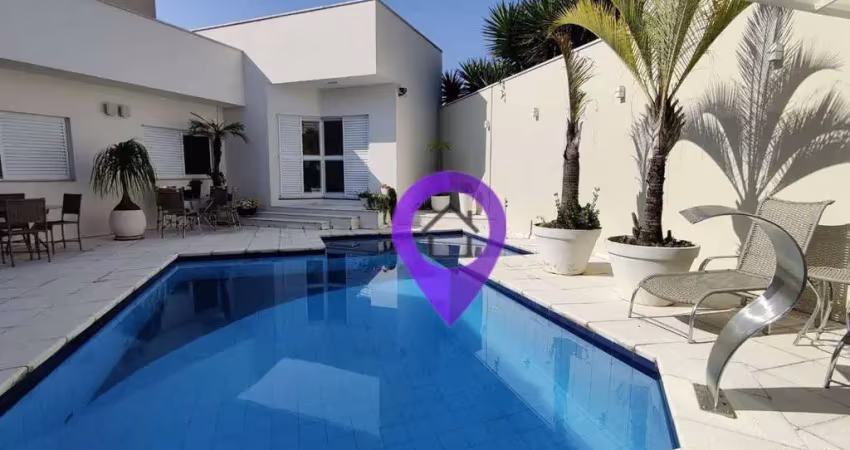 Casa de 500m² à venda em Pouso Alegre com 5 suítes, spa completo com jacuzzi e sauna, piscina aquecida e academia privativa.