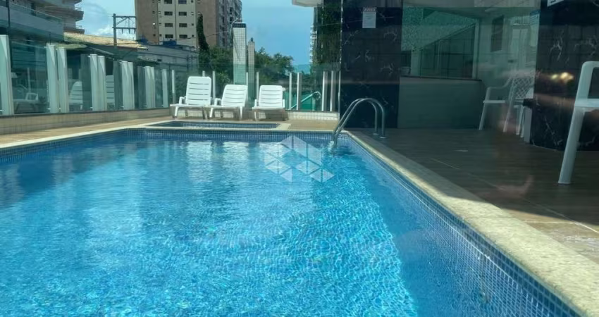 apartamento a venda na praia grande, bairro caiçara com 2 quartos 1 suite e 1 vaga.