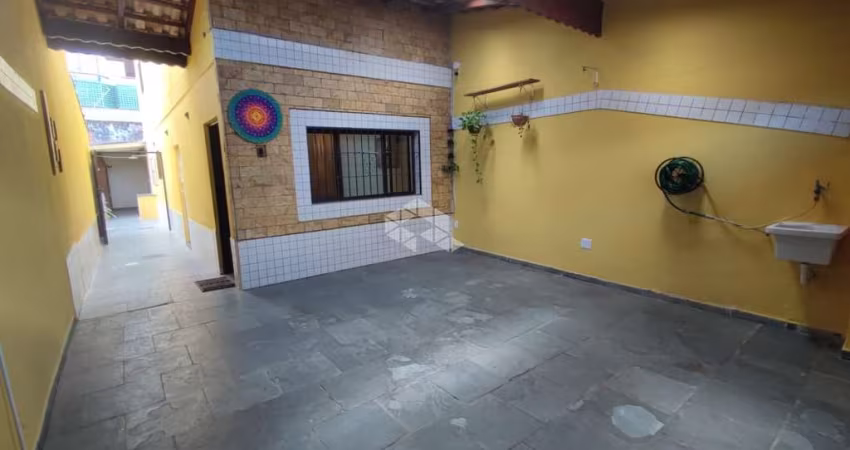 Sobrado geminado a venda na praia grande, bairro maracanã, 2 suites e 2 vagas vista mar