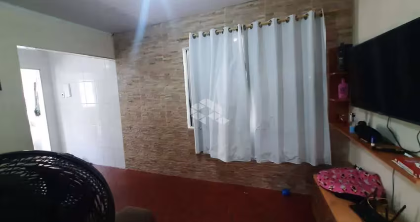 Casa a venda na praia grande, bairro solemar, com 1 quarto e 1 vaga