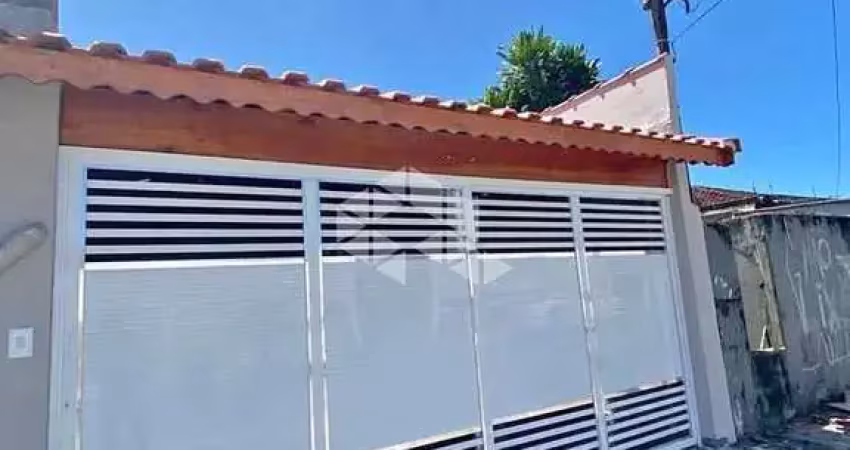 Casa geminada a venda na praia grande, bairro maracanã, com 2 quartos e 2 vagas