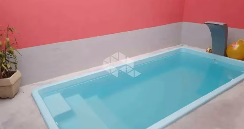 Casa geminada a  venda na praia grande, bairro caiçara, com 2 quartos, 1 suite e 2 vagas