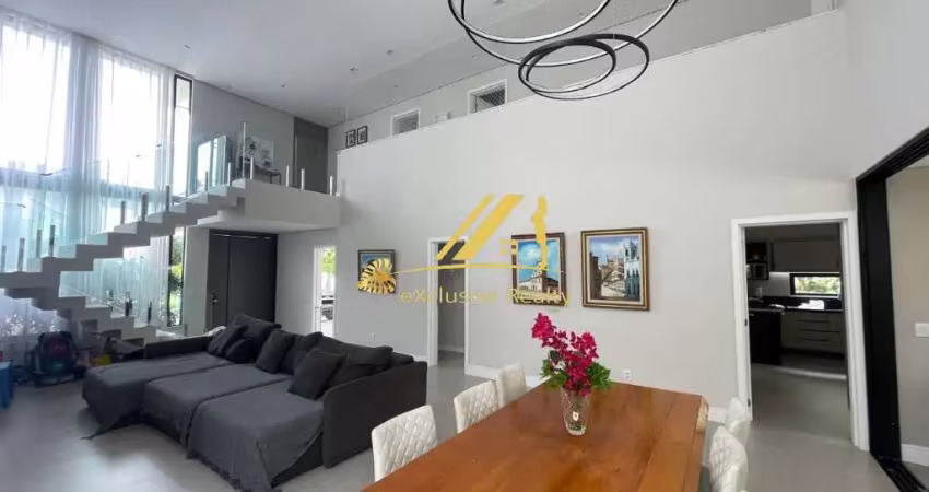 Casa moderna e sofisticada no Alphaville 1. Condomínio Itaparica. 4 suítes, piscina, área gourmet. 400m2 de área construída.