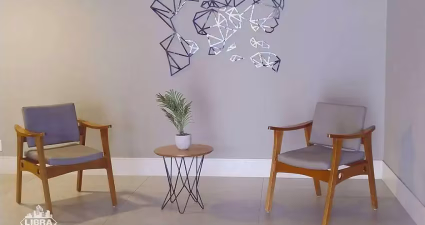 Apartamento de 1 quarto com cozinha americana e varanda à venda.