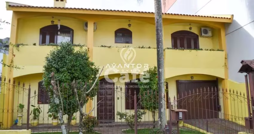 Casa 4 dormitórios com 2 salas, lareira, pátio e garagem para 3 carros
