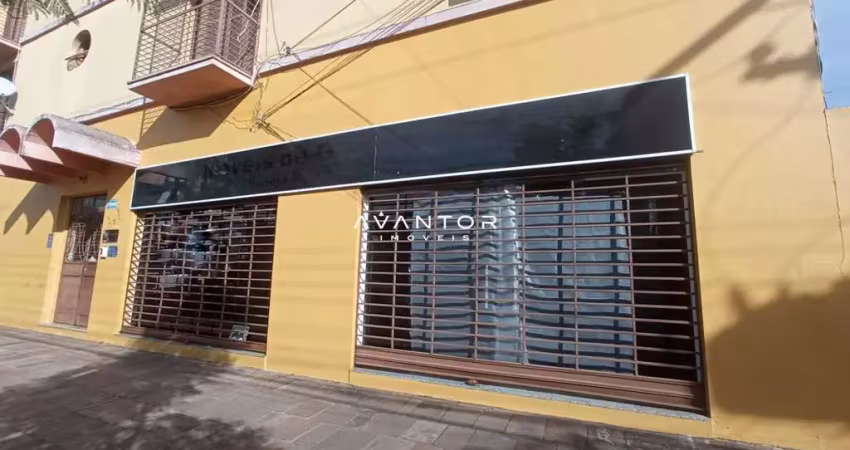Sala comercial central para locação de 60 m² e banheiro.