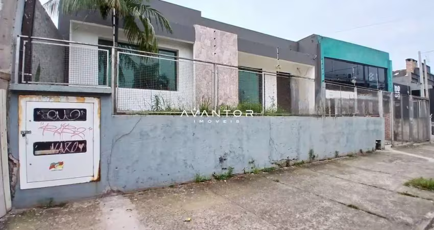 Casa comercial ampla no bairro lourdes com 4 salas, 3 banheiros, pátio e estacio