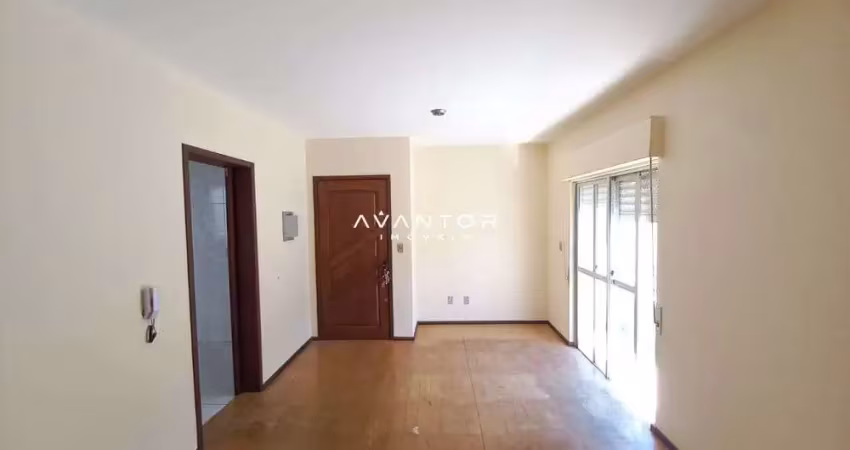 Apartamento de 2 dormitórios, sala de estar com sacada, banheiro e vaga.