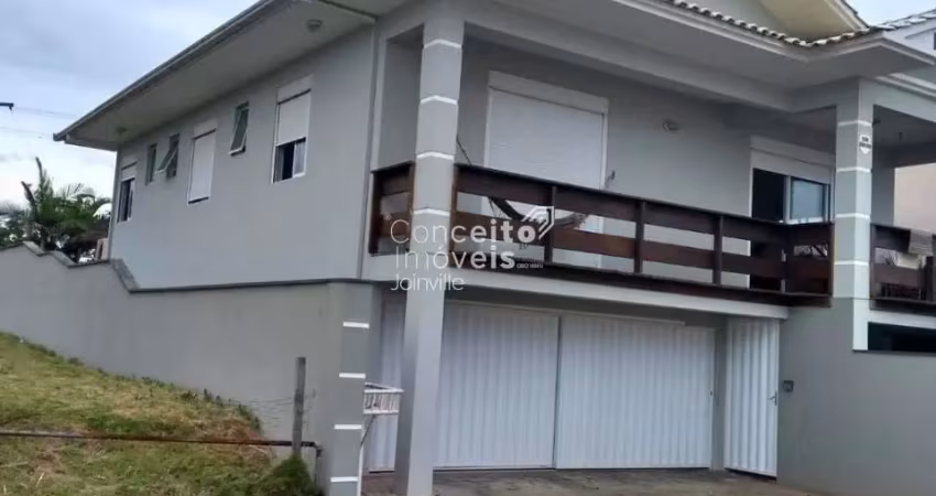 Sobrado com 4 suítes, área gourmet e vista para o mar