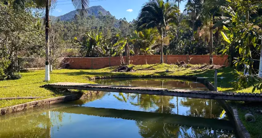 Sítio em canelinha com linda lagoa e totalmente plano aceita permuta