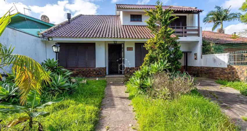 Casa com 3 quartos à venda na Rua Mura, 60, Guarujá, Porto Alegre