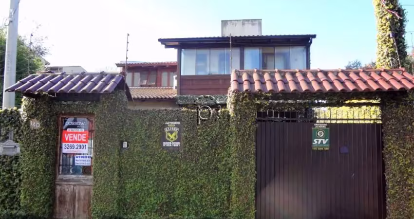 Casa com 3 quartos à venda na Avenida Guarujá, 140, Guarujá, Porto Alegre