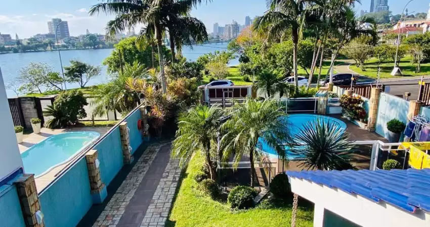 Belíssima casa com piscina as margens da lagoa do violão em torres