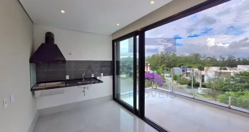 Casa contemporânea de alto padrão com espaço gourmet e área verde.